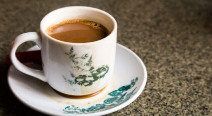 Traditional oriental Chinese coffee in vintage mug and saucer